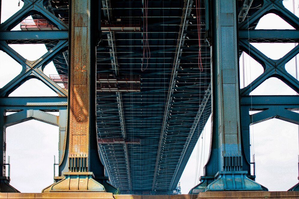 low angle shot big blue metal bridge sunny day 181624 2755